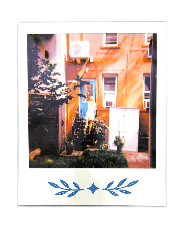 An orange house front with a bright blue door.