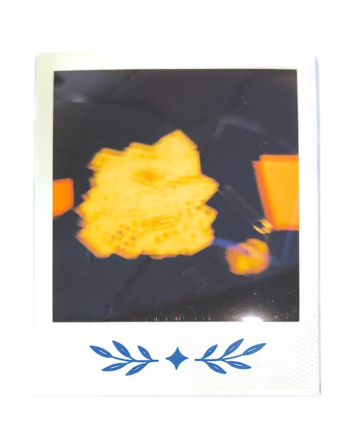 A lamp glowing yellow, out of focus.