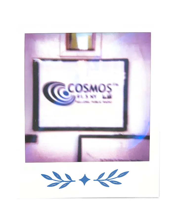 The Cosmos FM sign, soft and out of focus.